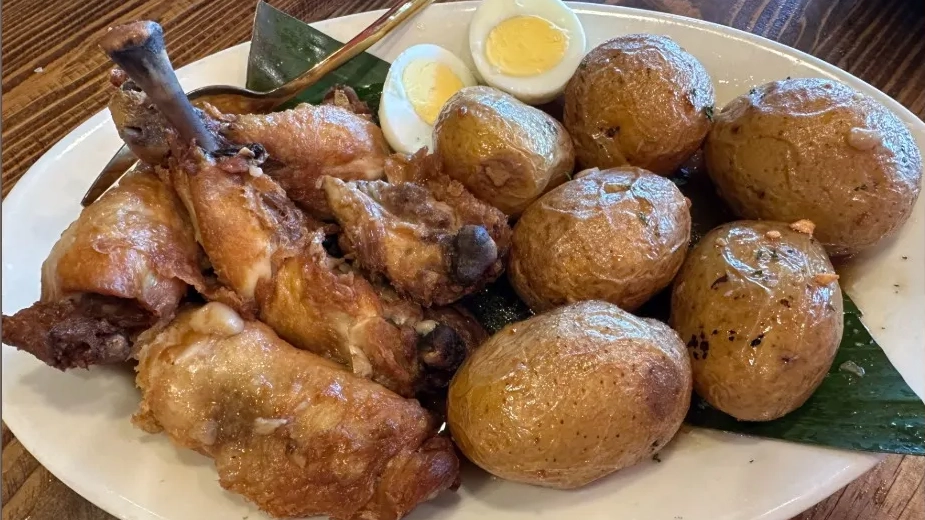 A plate of chicken adobo featured in an article about Lasang Pinoy on Axios Northwest Arkansas.
